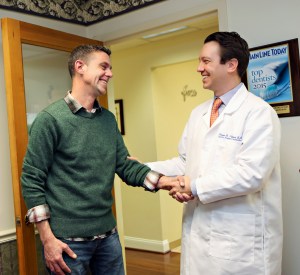 Doctor Sierakowski shaking a patient's hand