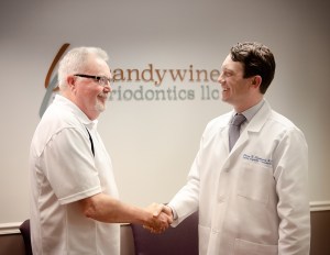 Dr Sierakowski greeting a patient